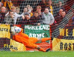 James Belshaw saves Dayle Southwell's penalty